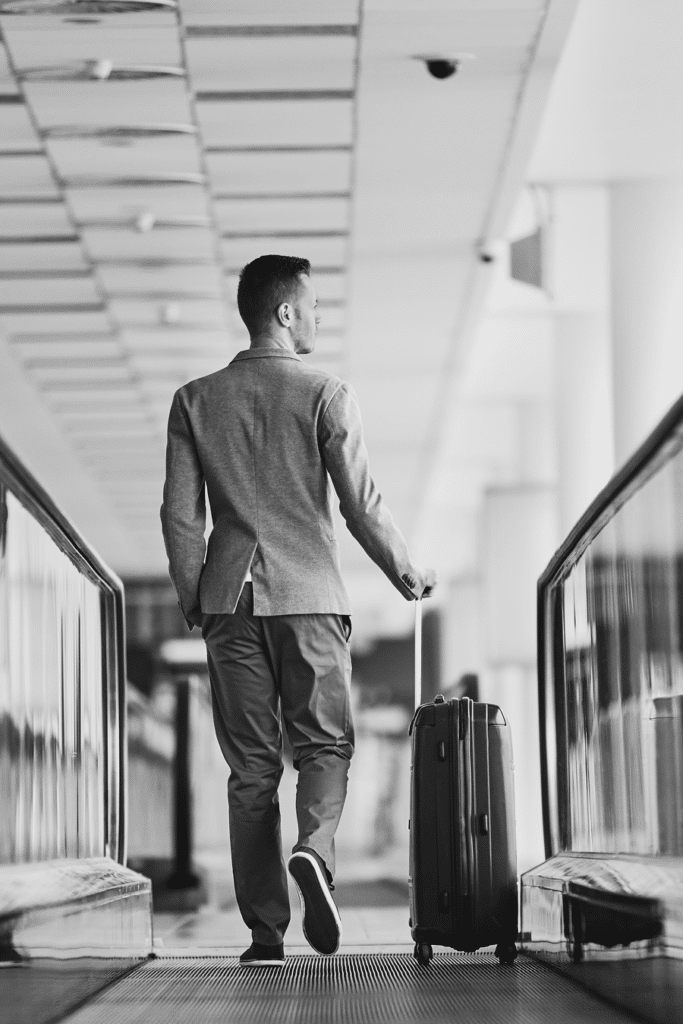man with suitcase in airport